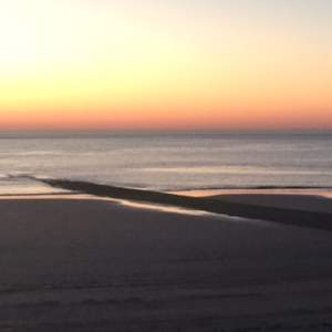 Sonnenuntergang bei Ebbe am Strand von Norderney